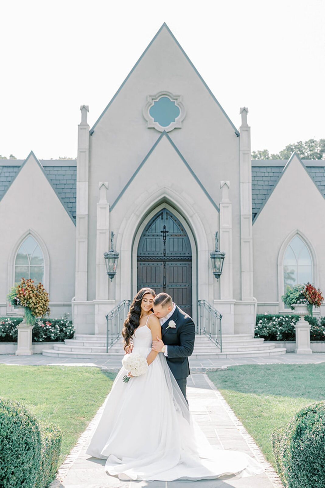 Bride and groom in the grand chapel at Park Château wedding