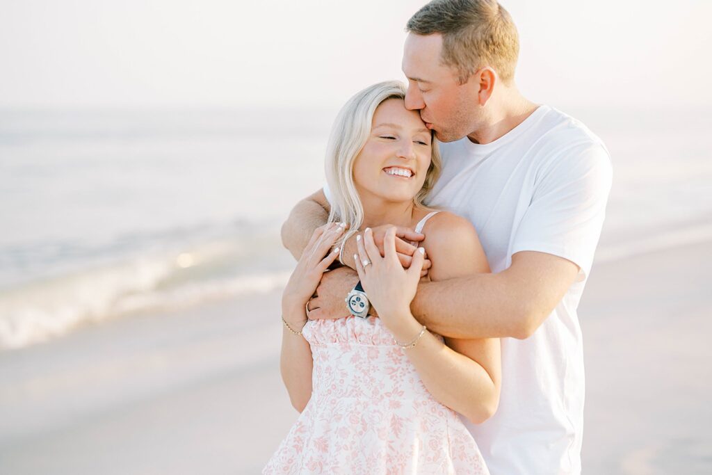 Romantic engagement portraits with Cape May ocean and sunset background