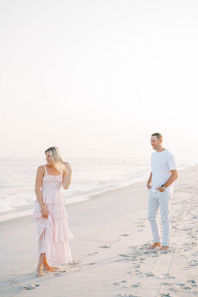 Romantic engagement portraits with Cape May ocean and sunset background
