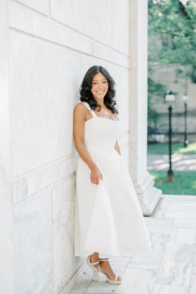 Couple embracing under the archways at Princeton University engagement session