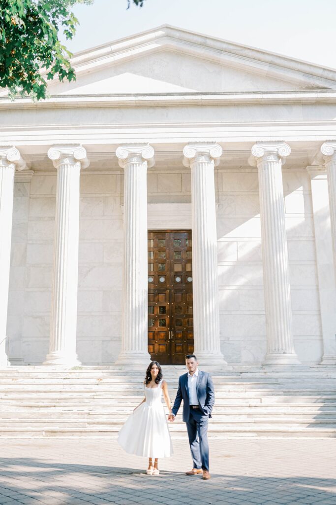 Couple walking together at Princeton University courtyard during NJ engagement photos