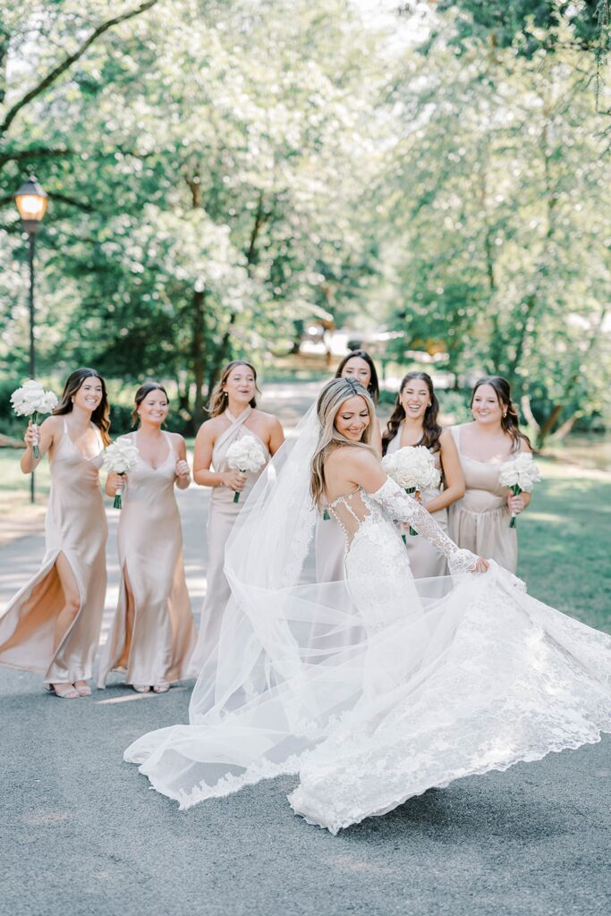 Bride with bridesmaids in champagne gowns at Appleford Estate wedding
