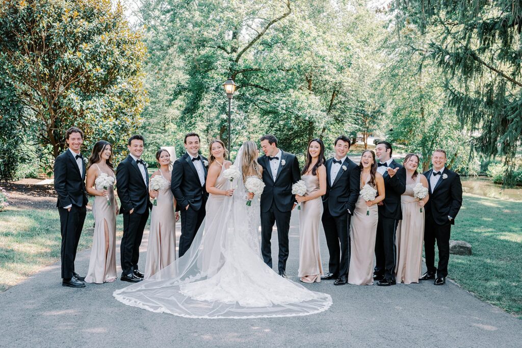Bride with bridesmaids in champagne gowns at Appleford Estate wedding