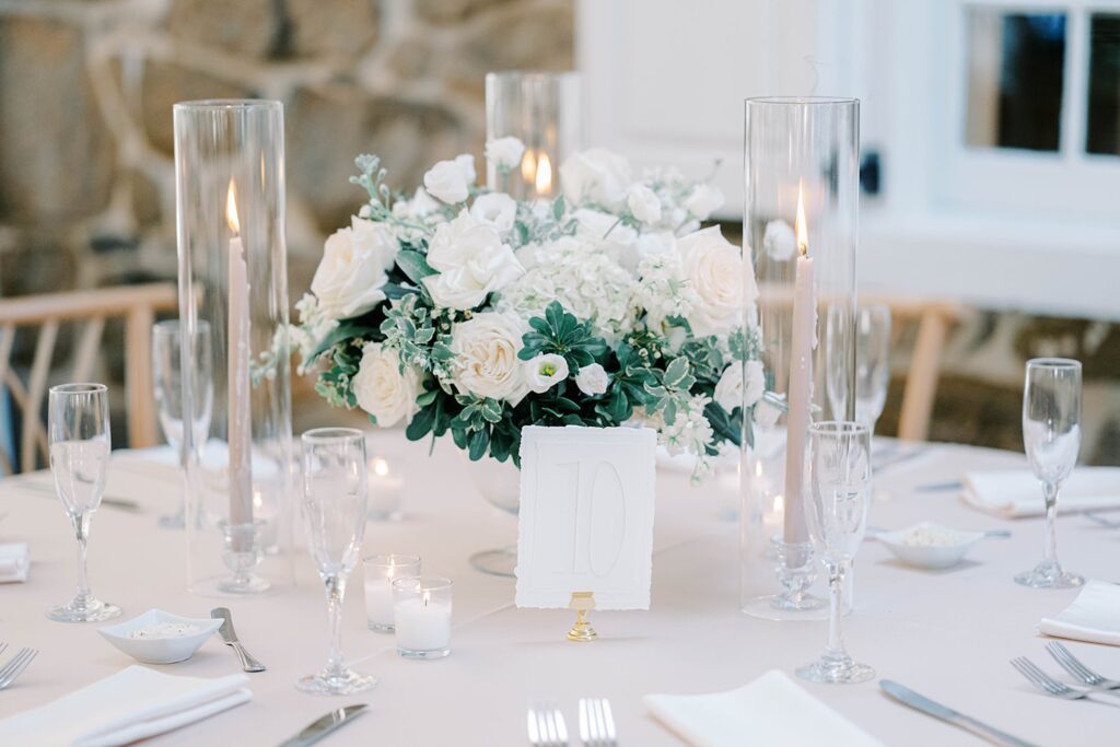 Reception details with taper candles and greenery at Appleford Estate
