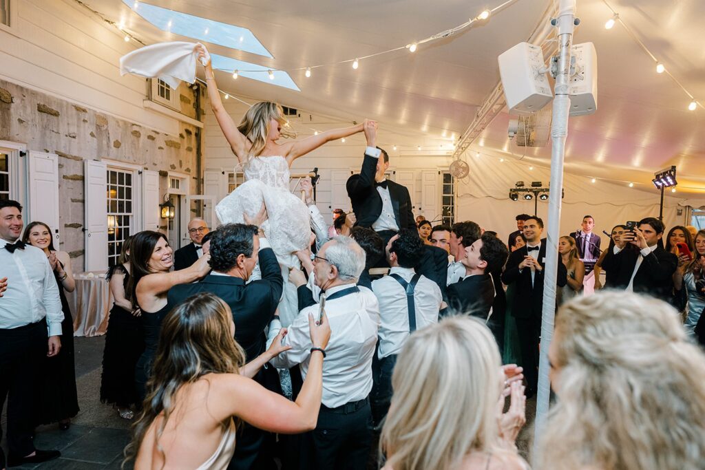 Summer evening reception tent at Appleford Estate with candlelight