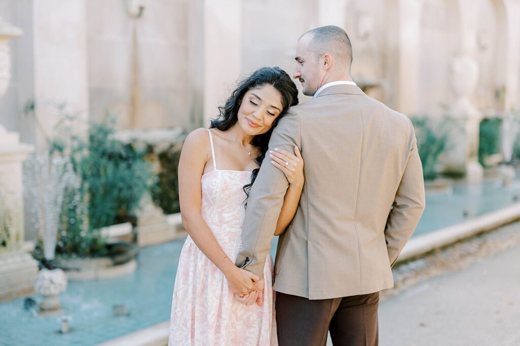 a warm fall embrace at Longwood gardens for a romantic engagement session 