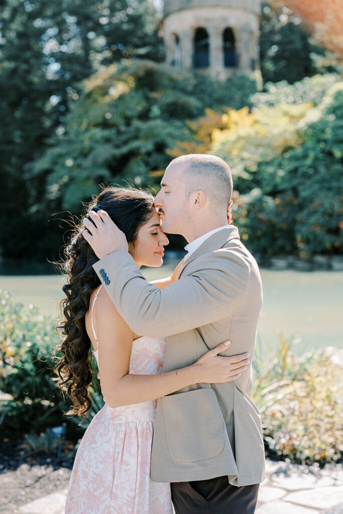 A romantic water tower and a warm forehead kiss at Longwood gardens engagement 