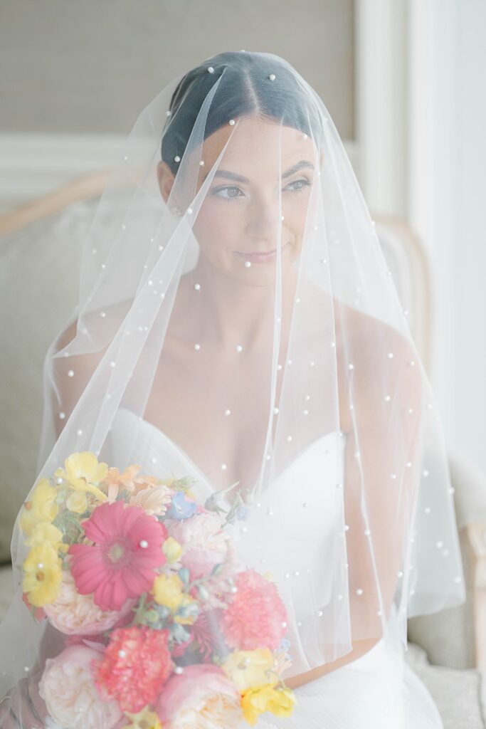 Close-up of bride's Newhite wedding dress and veil at New Jersey beach wedding