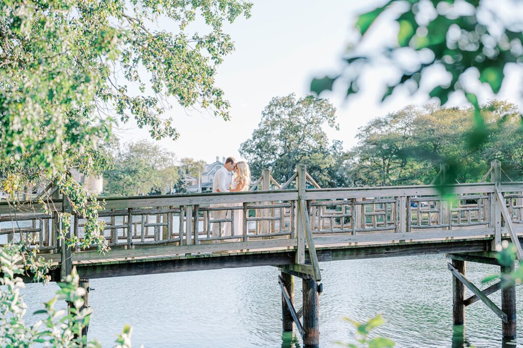 Spring Lake engagement session couple on wooden bridge at Divine Park New Jersey
