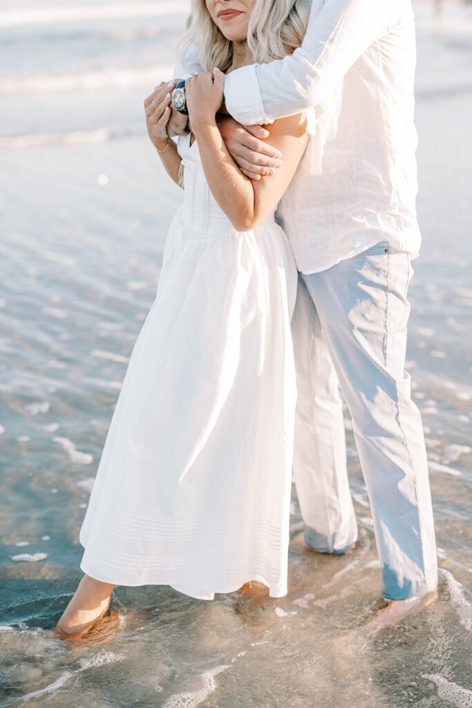 Spring Lake NJ engagement photos bride smiling on beach with fiancé