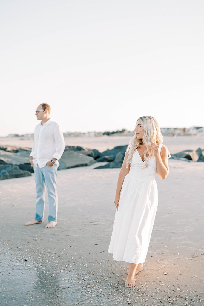 Sea Girt beach engagement photos couple dancing on sand at golden hour